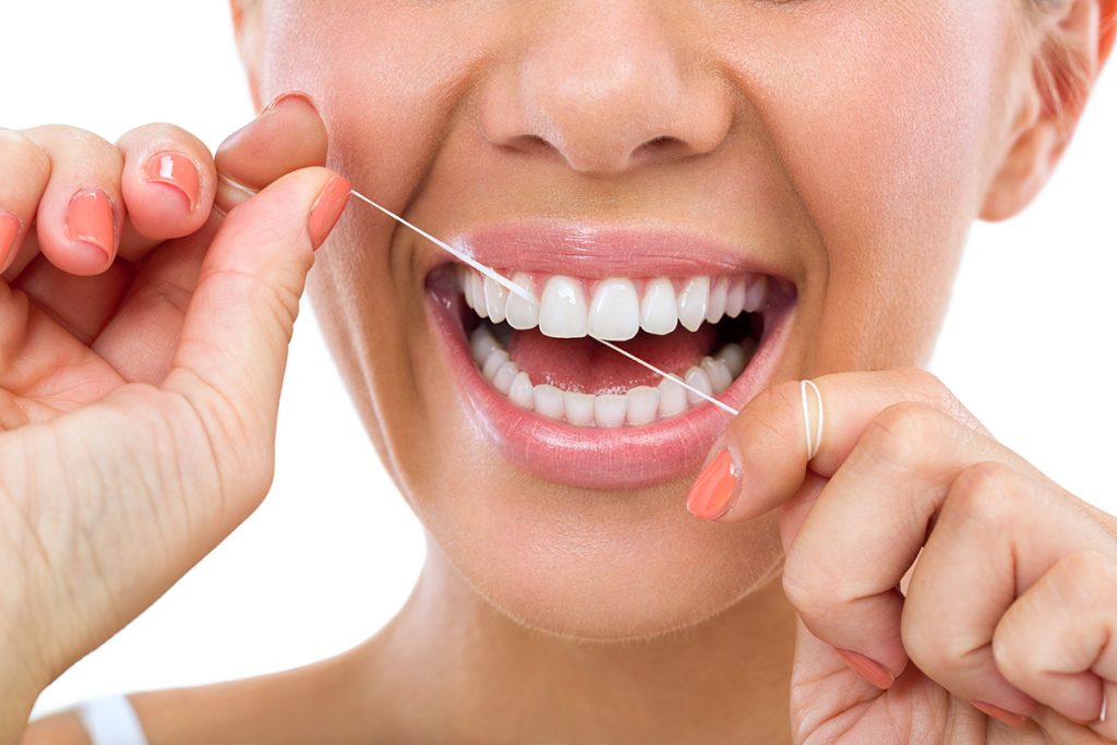 how to floss properly